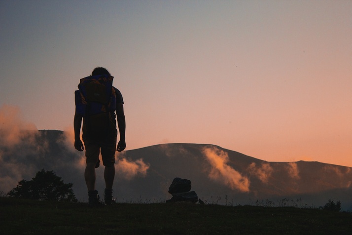 A leader leading their team up a mountain towards better customer relationships